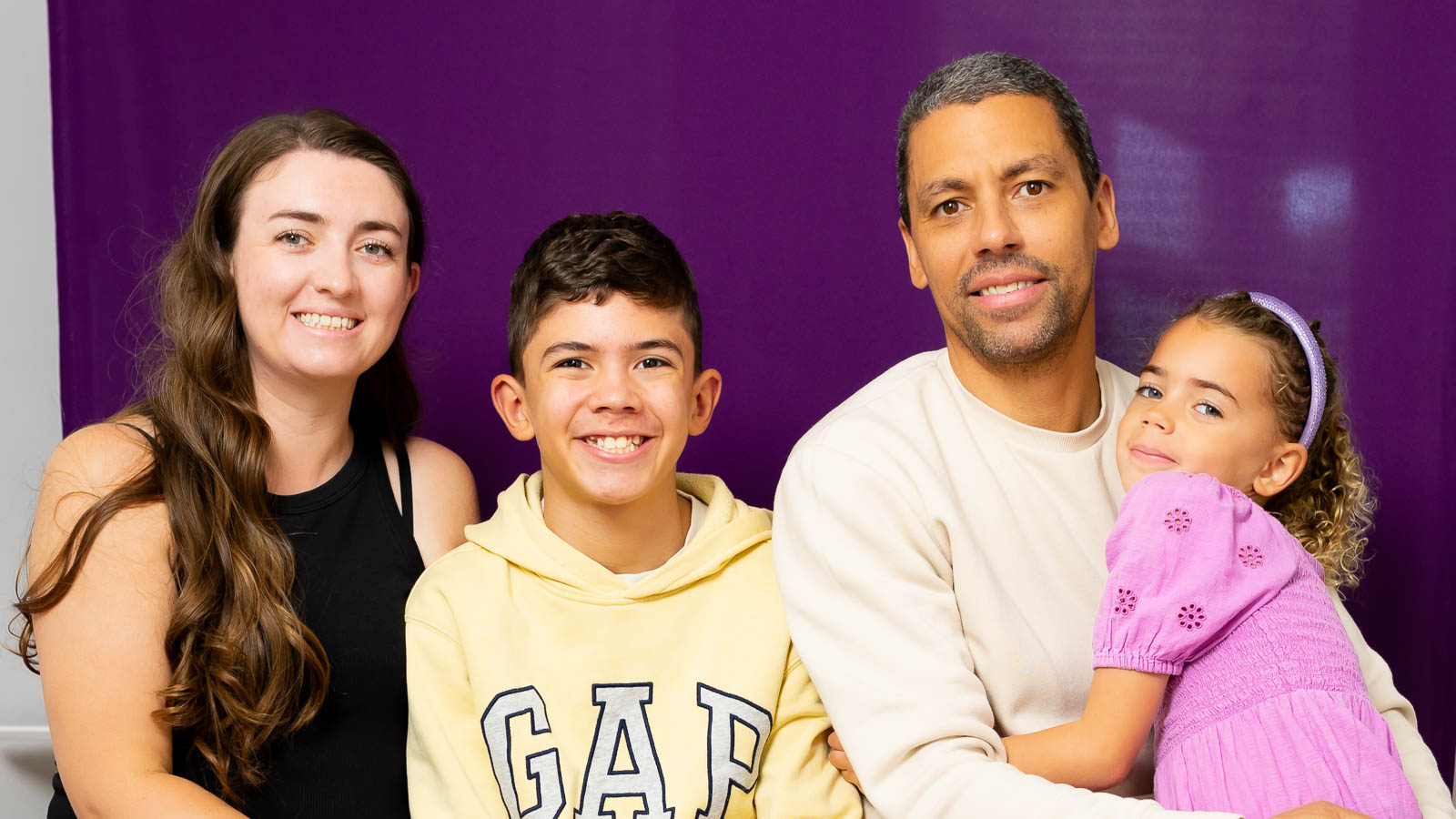 Natural family portrait in London with parents and children photographed by a London family photographer