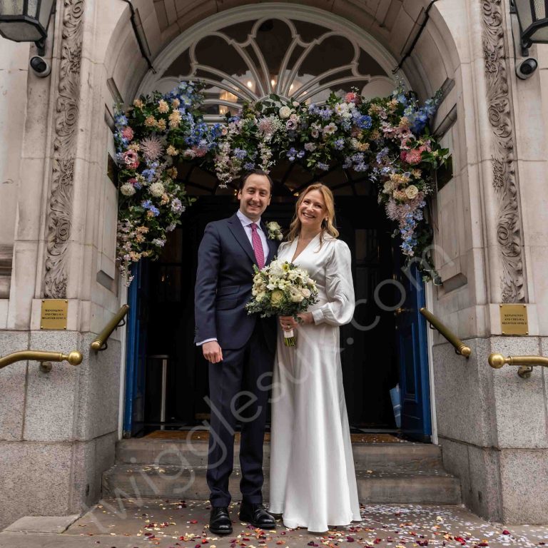 Bride and groom portrait outside Chelsea Old Town Hall during an intimate London registry office wedding.