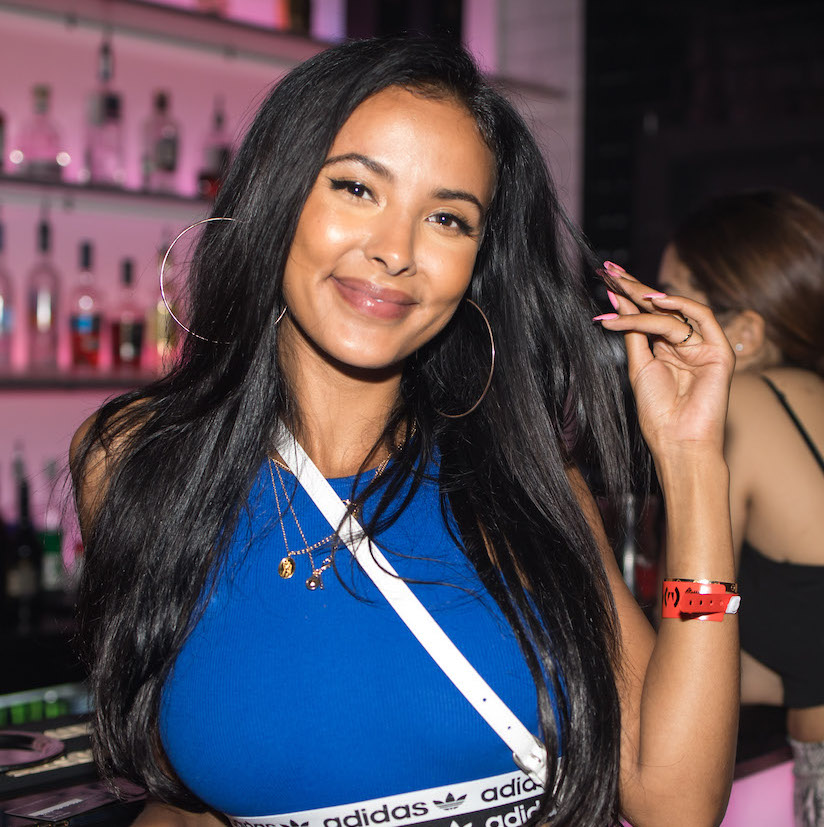 Guest portrait at a London nightclub event with vibrant lighting and flash photography