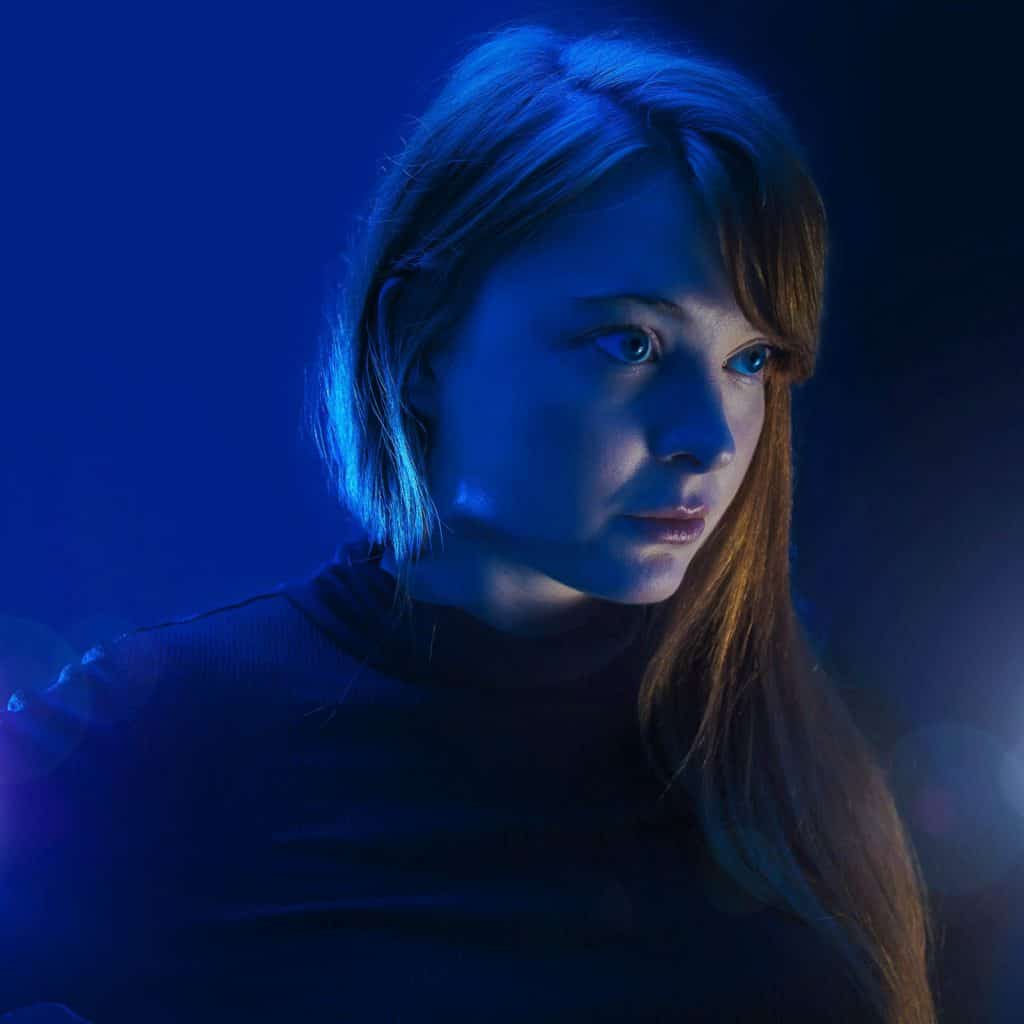 Studio portrait of an actress photographed in blue light by Twiggles UK