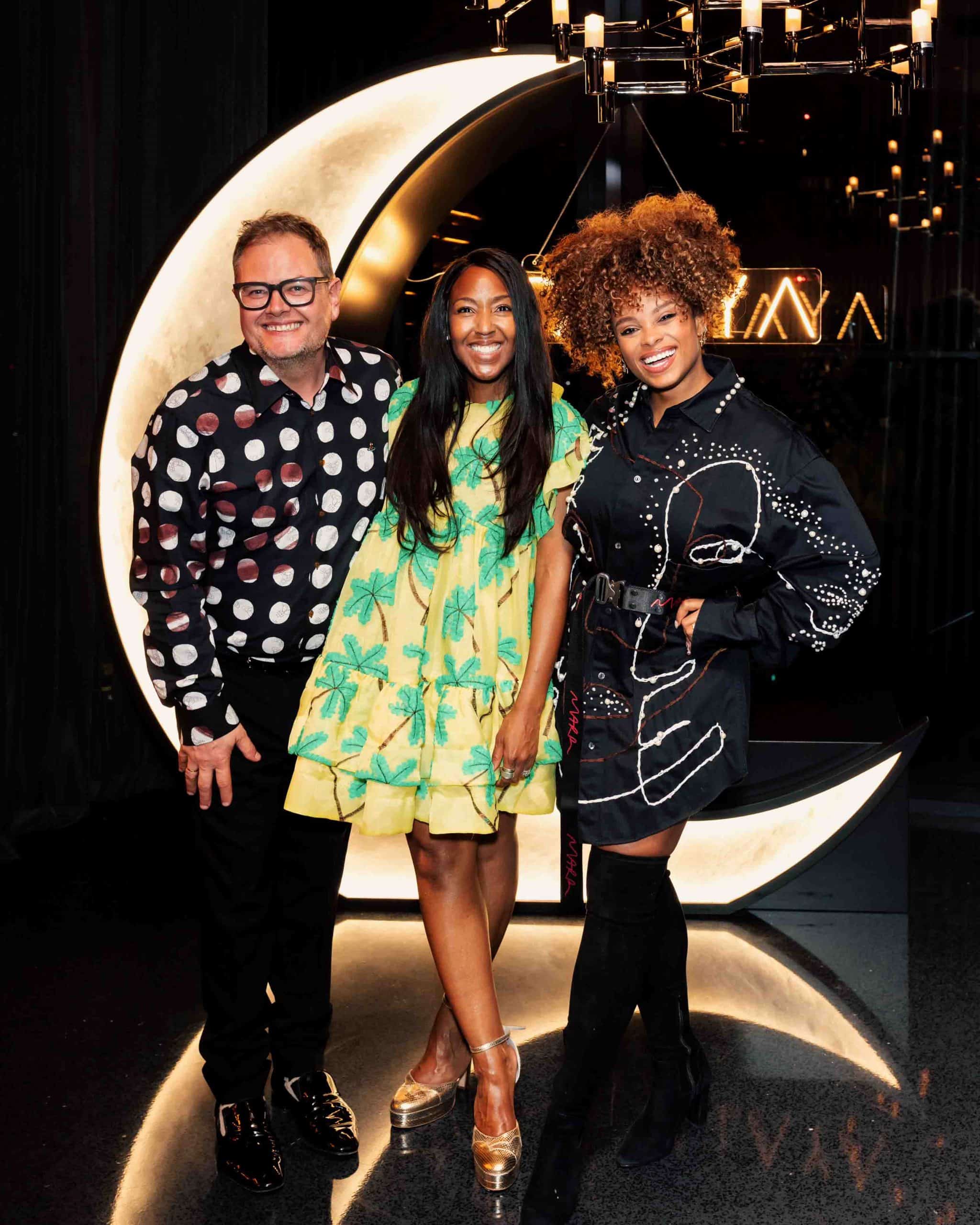 Alan Carr, Fleur East and Angelica Bell on the red carpet at a branded event