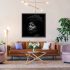 Gemma black and white portrait artwork displayed above a leather sofa in a contemporary living room