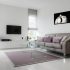 Hitchcock black and white photographic artwork displayed above a contemporary living room sofa