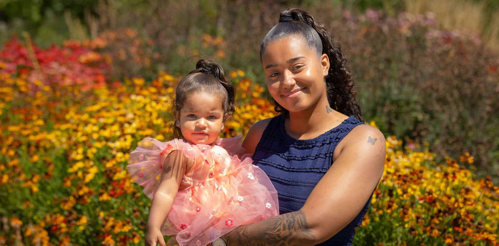 Mother and toddler portrait among wildflowers at Kew, London family photographer